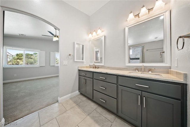 5210 E Chasemoor St, Pahrump, NV 89061 - full bath featuring a ceiling fan, double vanity, and tile patterned floors