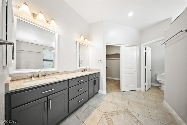 5210 E Chasemoor St, Pahrump, NV 89061 - bathroom with double vanity, tile patterned floors, and a walk in closet
