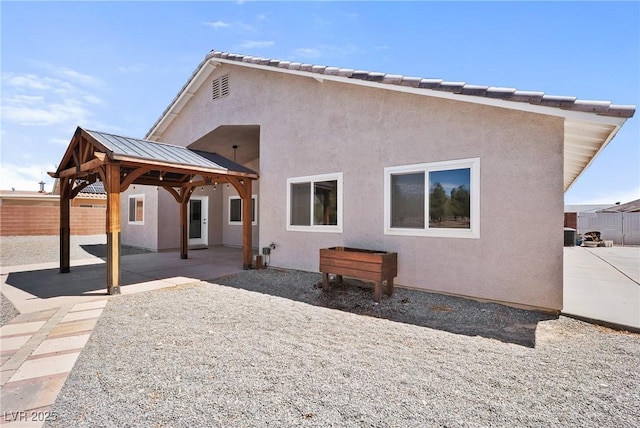 5210 E Chasemoor St, Pahrump, NV 89061 - rear view of house with a gazebo, stucco siding, and a patio