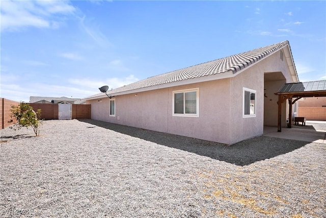 5210 E Chasemoor St, Pahrump, NV 89061 - view of home's exterior with a fenced backyard, stucco siding, and a patio area