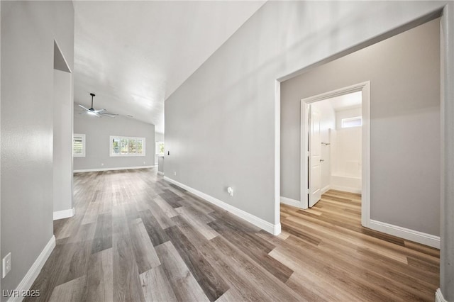 5210 E Chasemoor St, Pahrump, NV 89061 - unfurnished living room with ceiling fan, wood finished floors, and high vaulted ceiling
