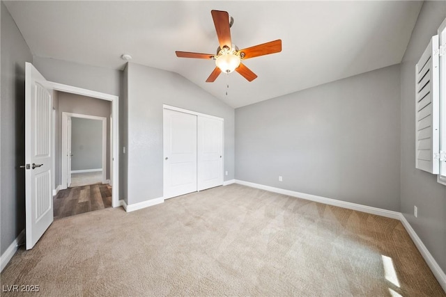 5210 E Chasemoor St, Pahrump, NV 89061 - unfurnished bedroom featuring carpet flooring, vaulted ceiling, a closet, and ceiling fan
