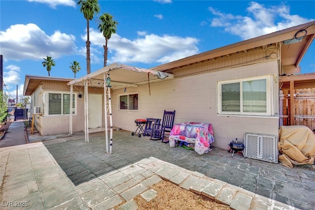 1205 Phillips Ave, Las Vegas, NV 89104 - back of house with a patio and concrete block siding