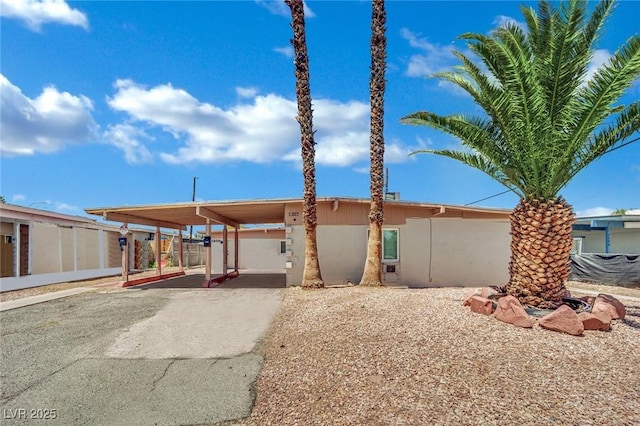 1205 Phillips Ave, Las Vegas, NV 89104 - view of front of home featuring stucco siding and a carport