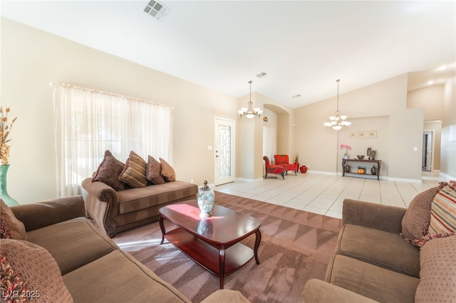 1442 Big Tree Ave, North Las Vegas, NV 89031 - living room with a chandelier, light tile patterned floors, and lofted ceiling
