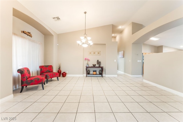 1442 Big Tree Ave, North Las Vegas, NV 89031 - sitting room featuring vaulted ceiling, a chandelier, arched walkways, and light tile patterned flooring