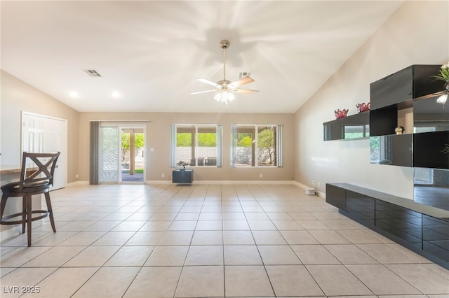 1442 Big Tree Ave, North Las Vegas, NV 89031 - unfurnished living room with lofted ceiling, a ceiling fan, healthy amount of natural light, and light tile patterned floors