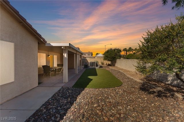 1442 Big Tree Ave, North Las Vegas, NV 89031 - fenced backyard with a patio