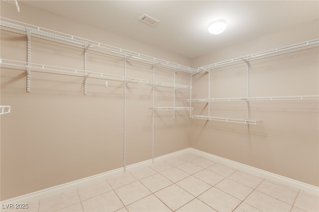 1442 Big Tree Ave, North Las Vegas, NV 89031 - walk in closet with light tile patterned floors