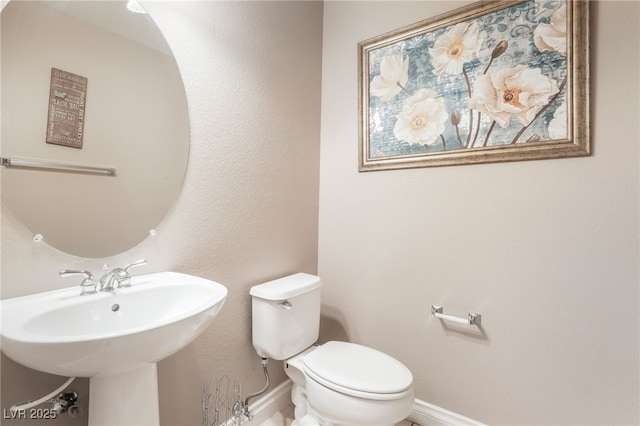 1442 Big Tree Ave, North Las Vegas, NV 89031 - bathroom with baseboards and toilet