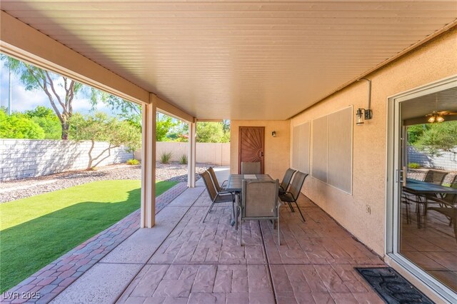 1442 Big Tree Ave, North Las Vegas, NV 89031 - fenced backyard featuring a patio and outdoor dining area