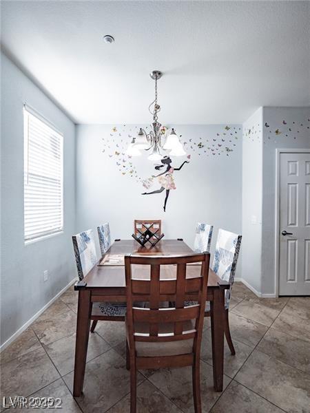 50 Aura De Blanco St Unit 13202, Henderson, NV 89074 - dining area with a chandelier and light tile patterned floors