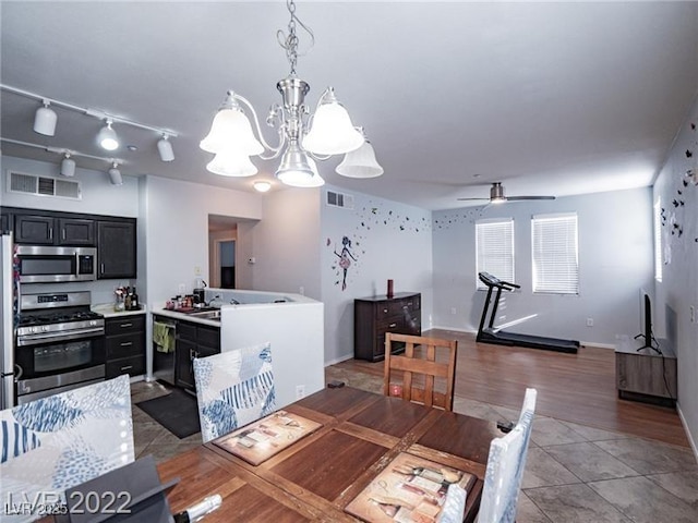 50 Aura De Blanco St Unit 13202, Henderson, NV 89074 - tiled dining area with a ceiling fan and a chandelier