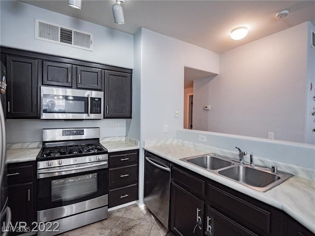 50 Aura De Blanco St Unit 13202, Henderson, NV 89074 - kitchen with appliances with stainless steel finishes, light countertops, and dark cabinetry