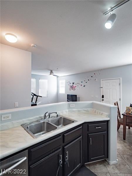 50 Aura De Blanco St Unit 13202, Henderson, NV 89074 - kitchen featuring dishwasher, light countertops, dark cabinetry, and light tile patterned floors