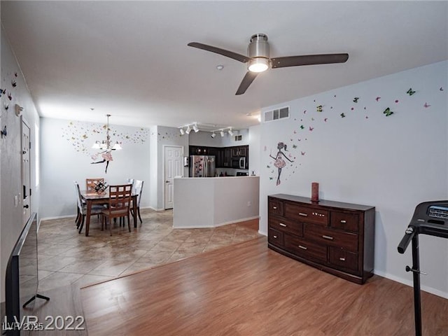 50 Aura De Blanco St Unit 13202, Henderson, NV 89074 - interior space featuring a ceiling fan, a chandelier, and light wood-style flooring