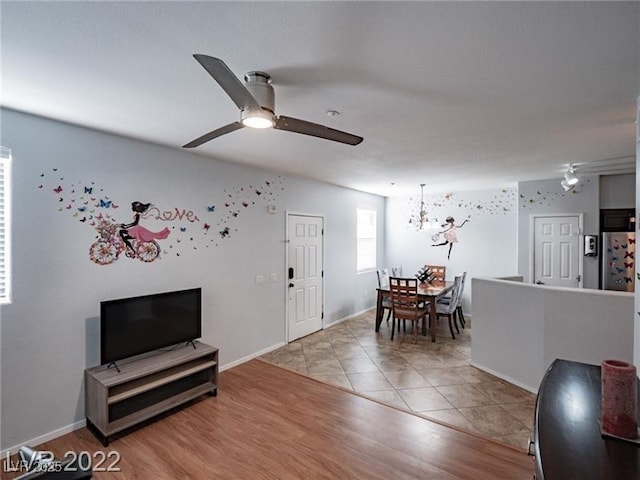 50 Aura De Blanco St Unit 13202, Henderson, NV 89074 - living area featuring a ceiling fan, a chandelier, and wood finished floors