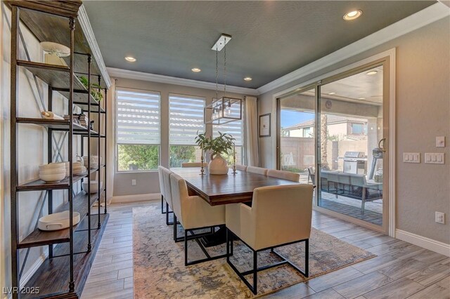 9964 Peaceful Peaks Ave, Las Vegas, NV 89166 - dining area with ornamental molding, wood finished floors, and recessed lighting