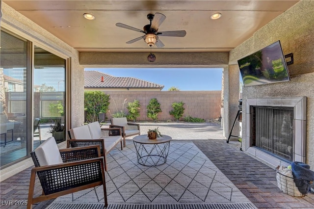 9964 Peaceful Peaks Ave, Las Vegas, NV 89166 - fenced backyard with a patio area, exterior fireplace, and a ceiling fan
