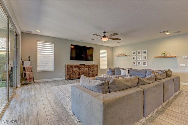 9964 Peaceful Peaks Ave, Las Vegas, NV 89166 - living room with light wood-style floors, plenty of natural light, a ceiling fan, and recessed lighting
