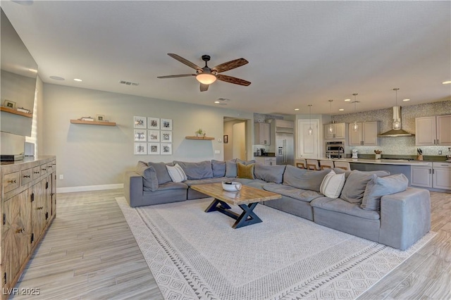 9964 Peaceful Peaks Ave, Las Vegas, NV 89166 - living room featuring a ceiling fan, light wood-style flooring, and recessed lighting