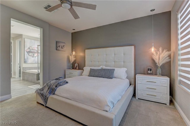 9964 Peaceful Peaks Ave, Las Vegas, NV 89166 - bedroom with light colored carpet, ensuite bathroom, and a ceiling fan