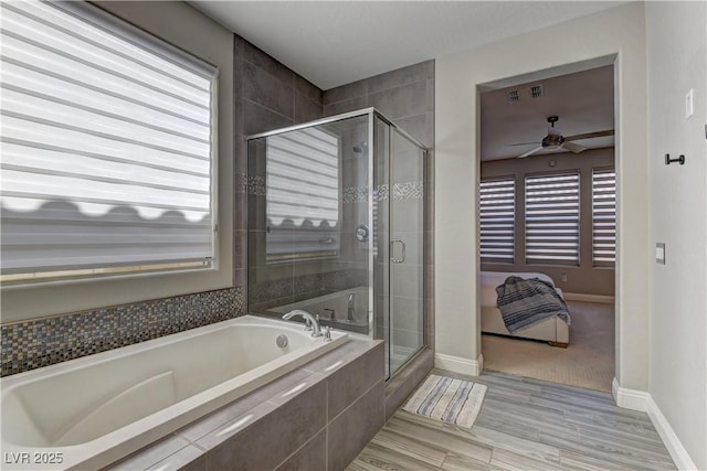 9964 Peaceful Peaks Ave, Las Vegas, NV 89166 - ensuite bathroom with a bath, a ceiling fan, a stall shower, and plenty of natural light