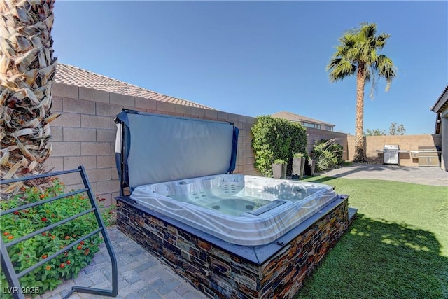 9964 Peaceful Peaks Ave, Las Vegas, NV 89166 - fenced backyard with a hot tub and a patio area