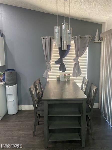 1841 Skywood Way, Las Vegas, NV 89142 - dining space with a textured ceiling and dark wood-type flooring