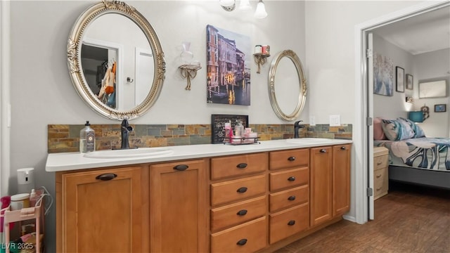 7723 Widewing Dr, North Las Vegas, NV 89084 - bathroom with connected bathroom, double vanity, and backsplash