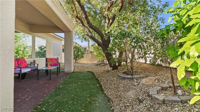 7723 Widewing Dr, North Las Vegas, NV 89084 - fenced backyard with a patio area