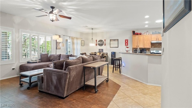 7723 Widewing Dr, North Las Vegas, NV 89084 - tiled living room featuring ceiling fan and recessed lighting