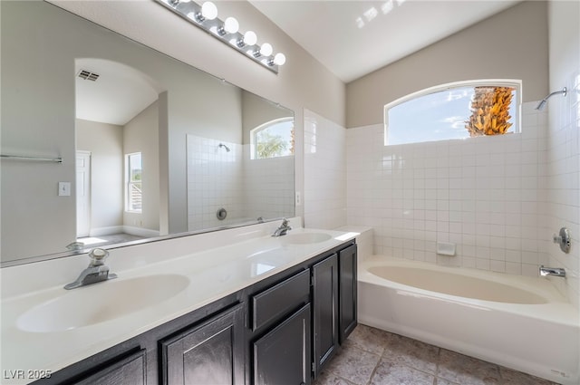 258 Horizon Pointe Cir, Henderson, NV 89012 - full bathroom featuring plenty of natural light, double vanity, shower / washtub combination, and tile patterned flooring