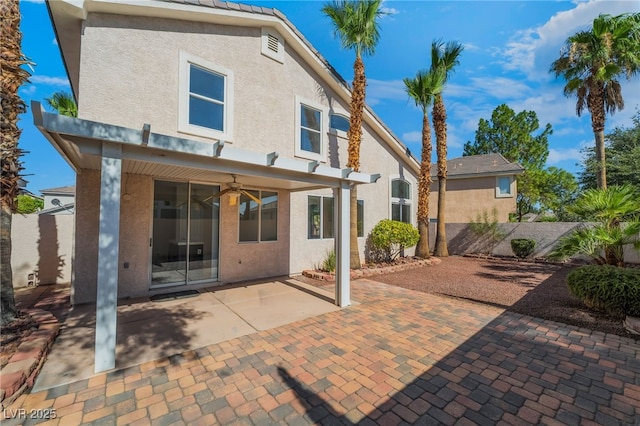 258 Horizon Pointe Cir, Henderson, NV 89012 - back of house with stucco siding, a ceiling fan, and a patio area