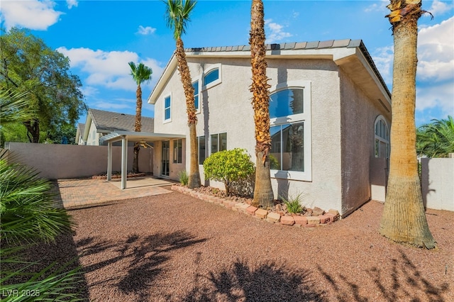 258 Horizon Pointe Cir, Henderson, NV 89012 - back of property with stucco siding, a patio, and a fenced backyard