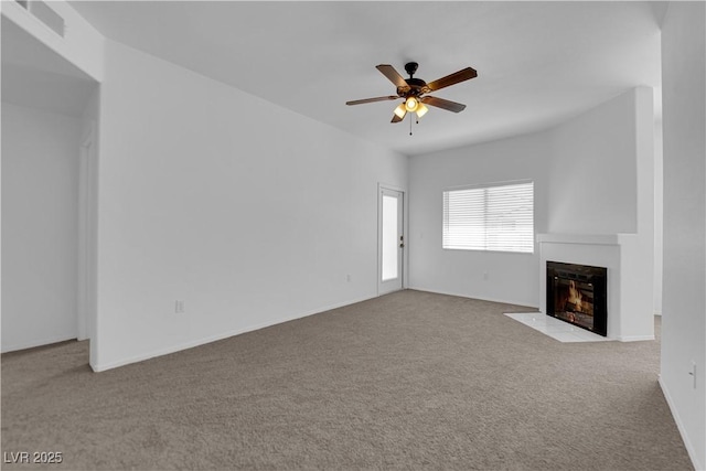 8501 W University Ave Unit 2053, Las Vegas, NV 89147 - unfurnished living room with ceiling fan, carpet flooring, and a fireplace with flush hearth