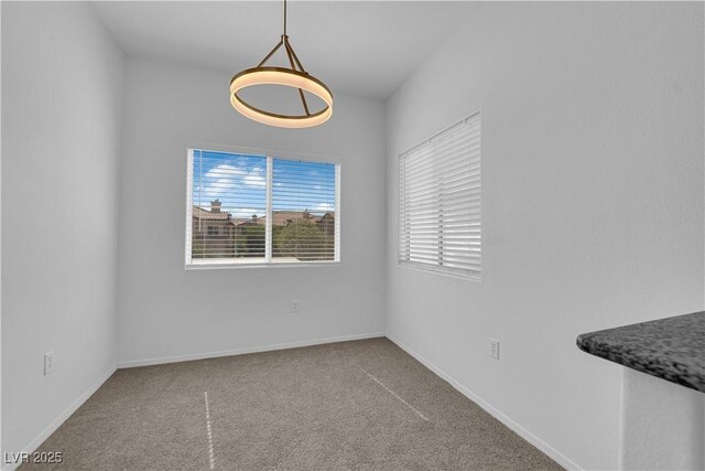 8501 W University Ave Unit 2053, Las Vegas, NV 89147 - unfurnished dining area featuring carpet flooring