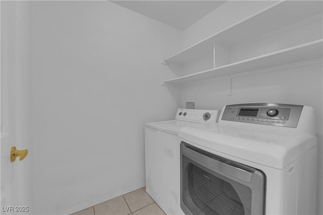 8501 W University Ave Unit 2053, Las Vegas, NV 89147 - laundry area with independent washer and dryer and light tile patterned floors