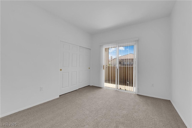 8501 W University Ave Unit 2053, Las Vegas, NV 89147 - unfurnished bedroom featuring carpet flooring and access to outside