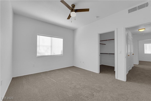 8501 W University Ave Unit 2053, Las Vegas, NV 89147 - unfurnished bedroom featuring carpet flooring, a spacious closet, and ceiling fan