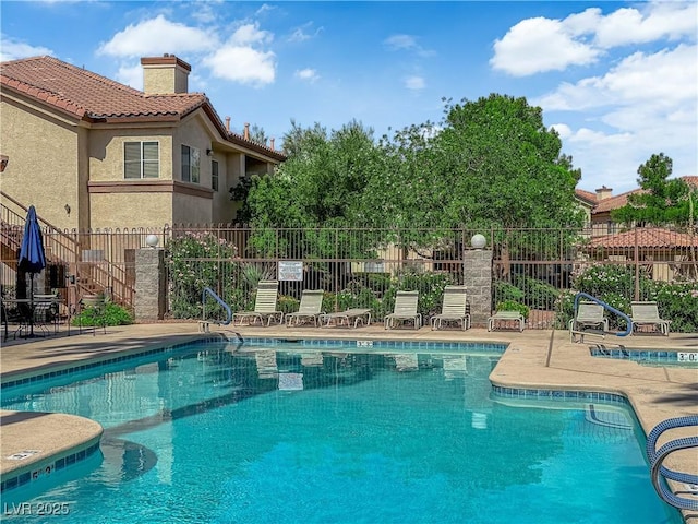 8501 W University Ave Unit 2053, Las Vegas, NV 89147 - community pool with a patio area