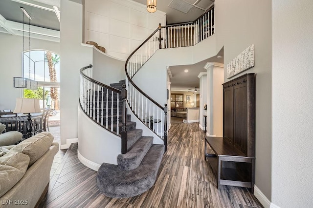 2458 Tour Edition Dr, Henderson, NV 89074 - stairway with a towering ceiling and wood finished floors
