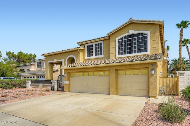 2458 Tour Edition Dr, Henderson, NV 89074 - view of front of home with a tiled roof, a garage, stucco siding, and concrete driveway