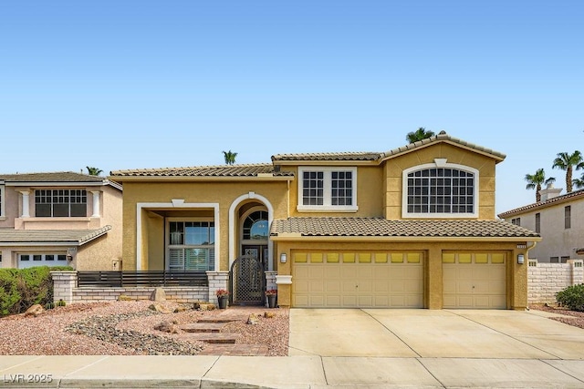 2458 Tour Edition Dr, Henderson, NV 89074 - view of front of property with a tile roof, an attached garage, driveway, and stucco siding