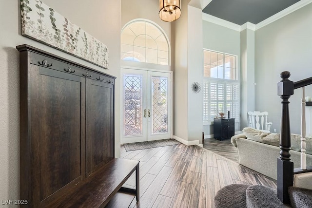 2458 Tour Edition Dr, Henderson, NV 89074 - foyer featuring a high ceiling, wood finish floors, ornamental molding, french doors, and stairs