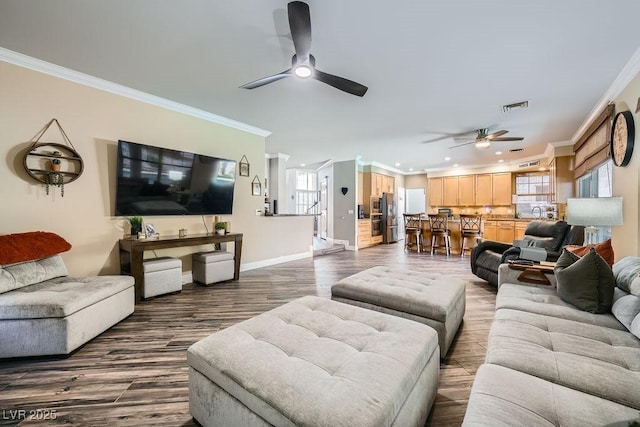 2458 Tour Edition Dr, Henderson, NV 89074 - living room with a ceiling fan, ornamental molding, dark wood-style flooring, and recessed lighting