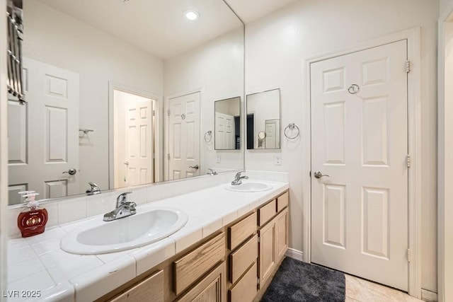 2458 Tour Edition Dr, Henderson, NV 89074 - full bath with double vanity and tile patterned floors