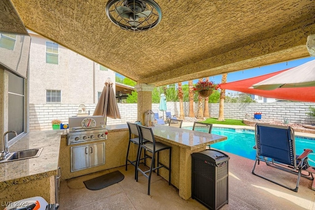 2458 Tour Edition Dr, Henderson, NV 89074 - fenced backyard featuring area for grilling and a patio area