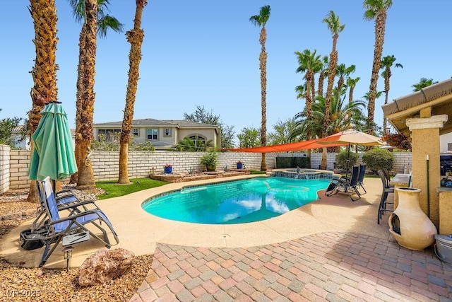 2458 Tour Edition Dr, Henderson, NV 89074 - view of pool with a patio area, a fenced backyard, and a pool with connected hot tub