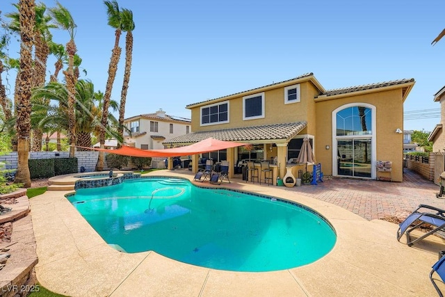 2458 Tour Edition Dr, Henderson, NV 89074 - view of pool featuring a patio area, a fenced backyard, and a pool with connected hot tub